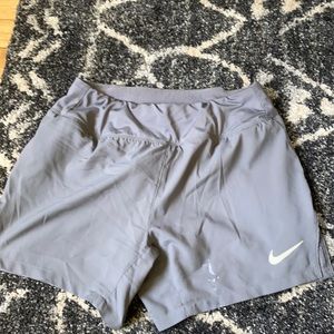 Slightly worn grey women’s lined shorts. Some paint on the front.